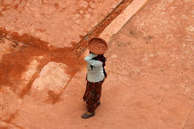 Full length of man standing on rock