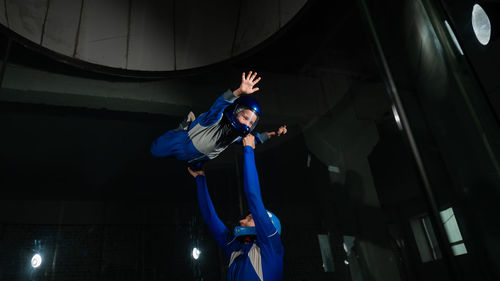 Low angle view of man dancing on stage