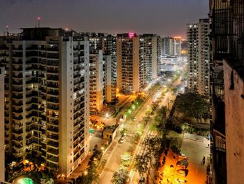 High angle view of illuminated city buildings at night