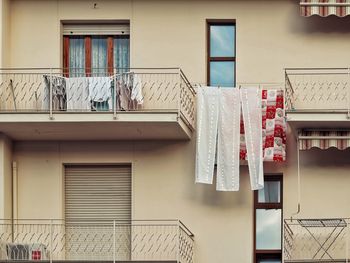 Low angle view of clothes drying outside building