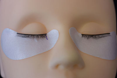 Close-up of mannequin with false eyelashes