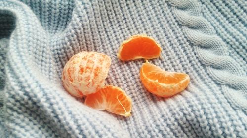 Close-up of orange slices on sweater