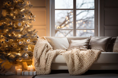 Close-up of christmas decorations on bed at home