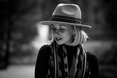 Portrait of a smiling young woman wearing hat