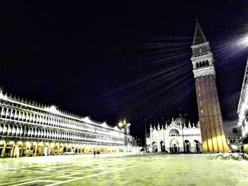 Buildings in city at night