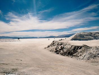 Scenic view of landscape against cloudy sky