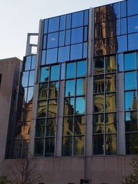 Low angle view of modern building against sky