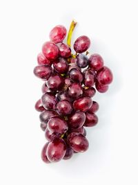 Close-up of grapes against white background