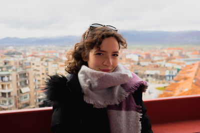 Girl posing for frontal picture in cold weather clothes