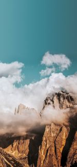 Smoke emitting from volcanic mountain against sky