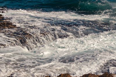 Sea waves splashing on shore