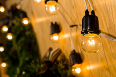 Low angle view of illuminated light bulb