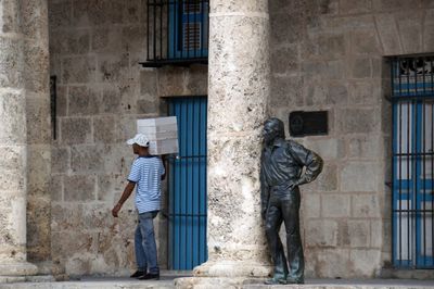 Rear view of men standing outside building