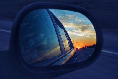 Reflection of sun on side-view mirror