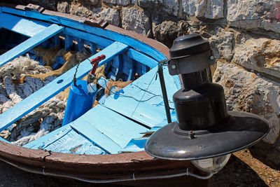 High angle view of old container on wall