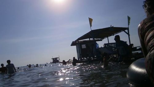 People on beach at sunset