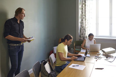 People in boardroom during business meeting