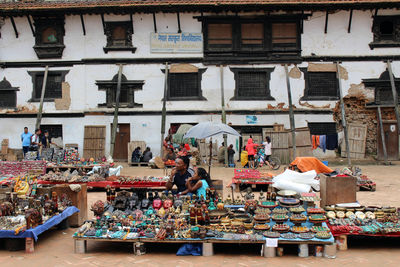 Group of people at market stall