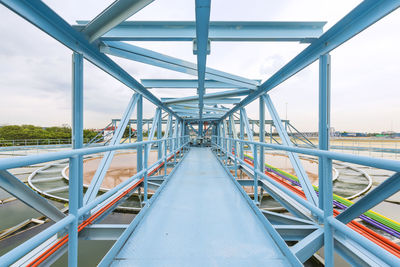 Bridge over footbridge against sky