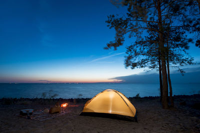 Scenic view of sea against sky at night