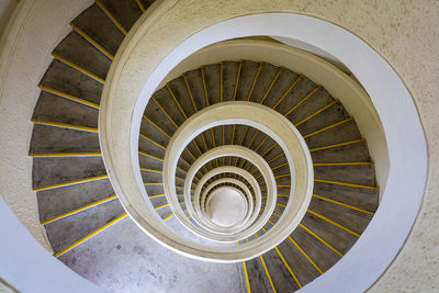 Directly above shot of spiral staircase in building