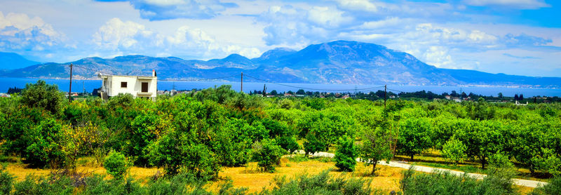 Scenic view of mountains against cloudy sky