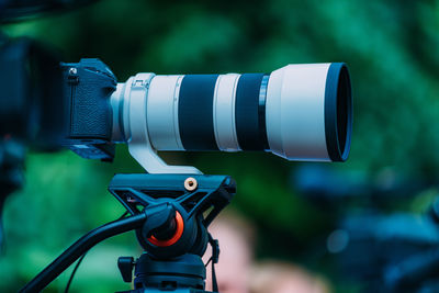 Cameras at a media conference outdoors.