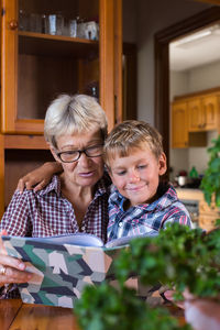 Homeschooling grandmother teaching kid, child, smart boy. happy family, education, studying concept.