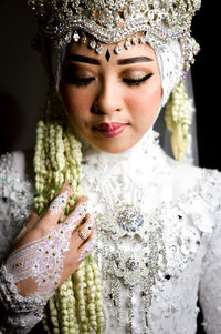 Close-up portrait of young woman, before the wedding.