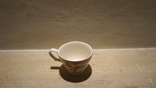 High angle view of coffee cup on table