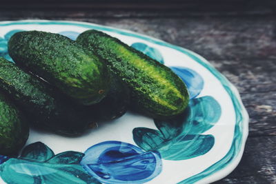 Close-up of cucumbers in plate on table