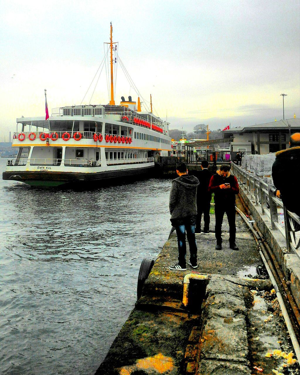 transportation, real people, mode of transport, rear view, nautical vessel, men, water, day, outdoors, river, built structure, full length, two people, lifestyles, sky, architecture, women, nature, togetherness, people