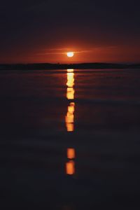 Scenic view of sea against romantic sky at sunset