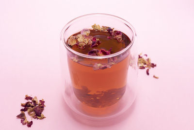 Close-up of drink in glass against white background