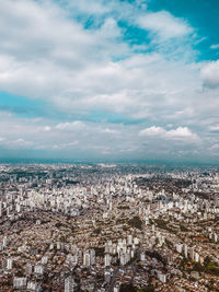 Aerial view of cityscape against sky