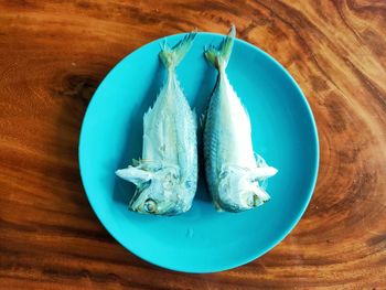 High angle view of fish in plate on table