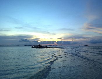 Scenic view of sea against sky at sunset