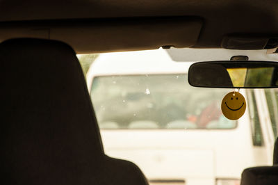 Smiley face hanging in car