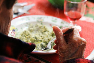 Close-up of hands on table