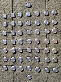 High angle view of stone on wall