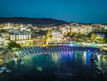 Illuminated buildings in city at night