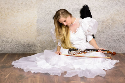 Girl playing with paper at home