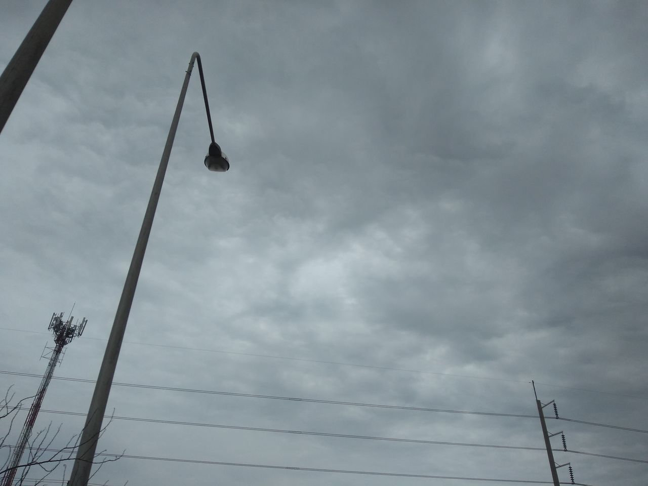 LOW ANGLE VIEW OF STREET LIGHTS AGAINST SKY