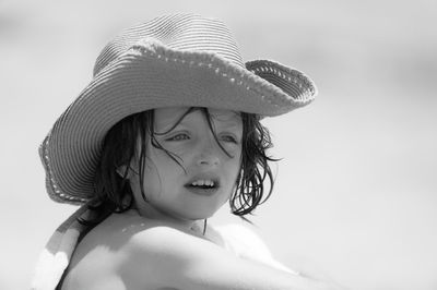 Portrait of woman wearing hat against sky