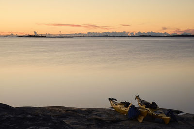 Kayaks on rocks at sea