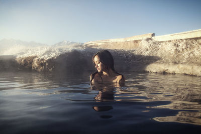 Woman relaxing in mammoth lake hot springs