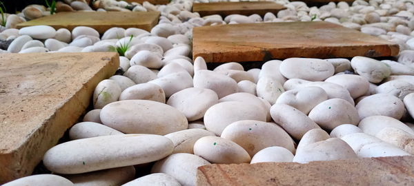 High angle view of pebbles in container