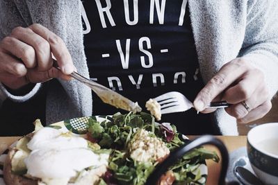 Midsection of man holding food