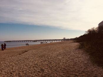 Scenic view of beach against sky during sunset