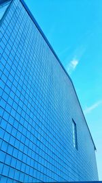 Low angle view of modern building against clear blue sky